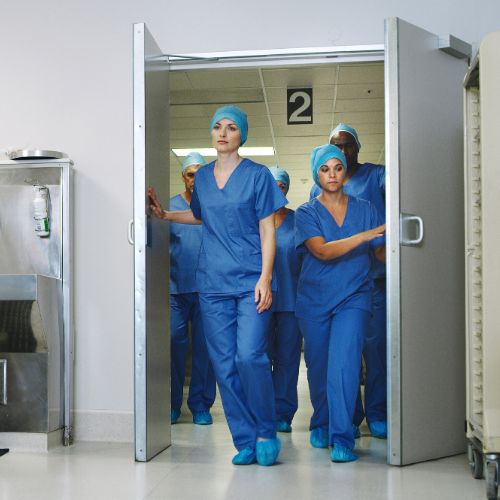 nurses walking through doors