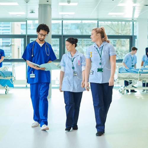 nurses walking through ward
