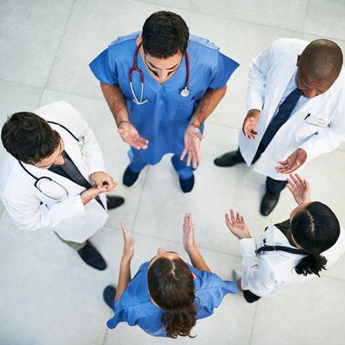 healthcare team standing in circle