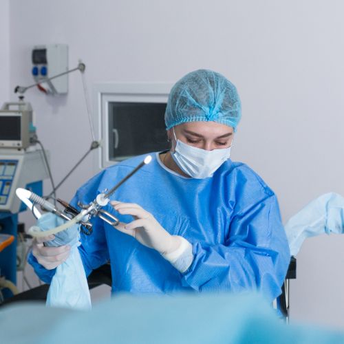 nurse holding operating equipment