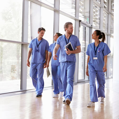 temporary doctors walking in corridor