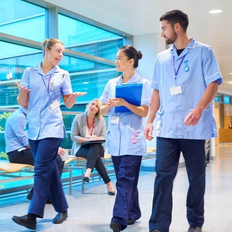 Medical staff walking down corridor
