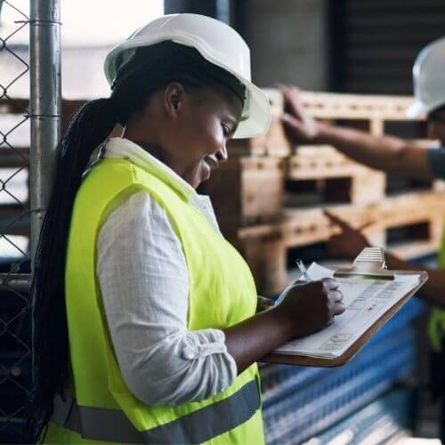 Female worker taking notes