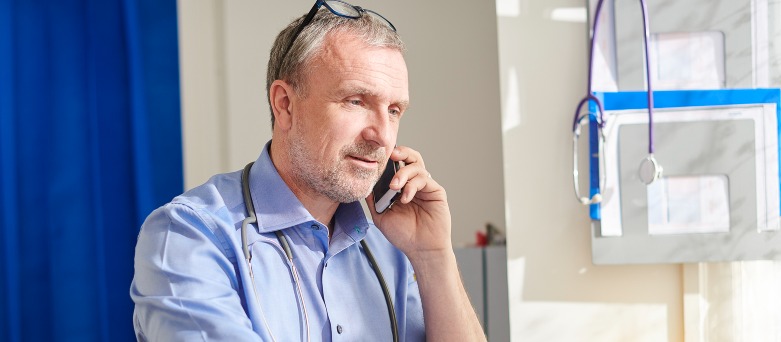 Accident and Emergency room with 3 doctors giving emergency care to patient