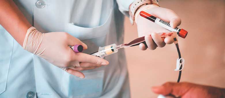 Haematology doctor taking bloods from a patient