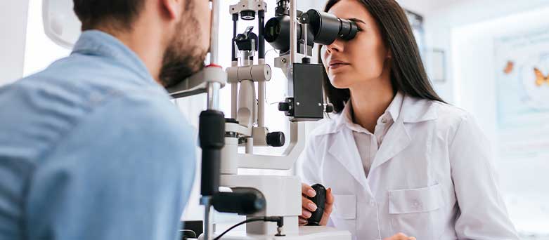 Ophthalmologist checking a patients eyes